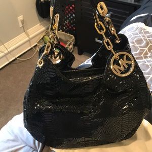 Never used black snakeskin Michael Kors bag